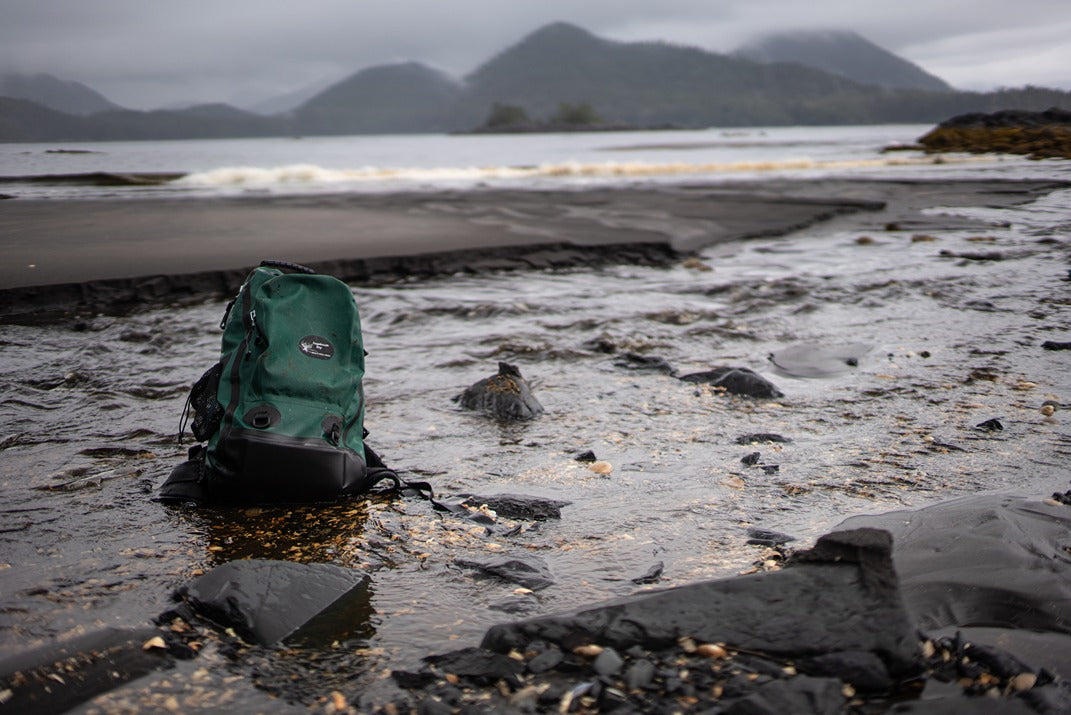 A Sagebrush Dry Gear bag sitting in a river in Southeast Alaska. 