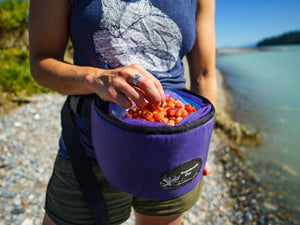 Woman wears Sagebrush Dry Hands Free Berry Basket